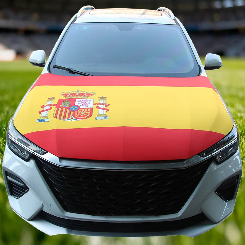 A white car hood decorated with a flag featuring the Spanish coat of arms in red, yellow, and gold stripes.