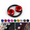 A close-up view of a red aluminum quick release fastener for automotive body parts.