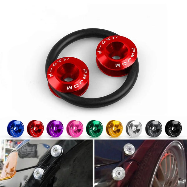 A close-up view of a red aluminum quick release fastener for automotive body parts.