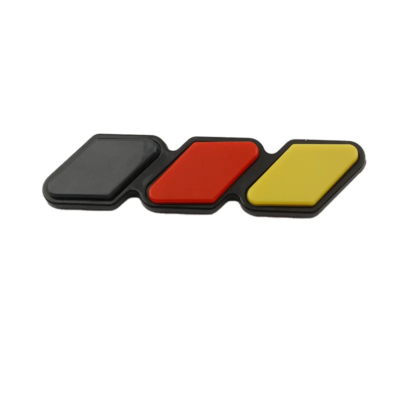 A set of three colored 3D car grill decals in black, red, and yellow.