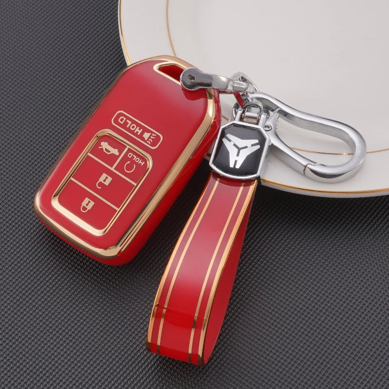 Étui de clé de voiture en TPU rouge avec une clé USB argentée, posé sur une surface sombre.