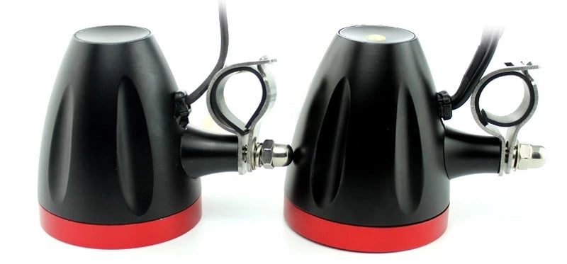 A black motorcycle Bluetooth speaker system with an FM radio and USB, shown from the side.