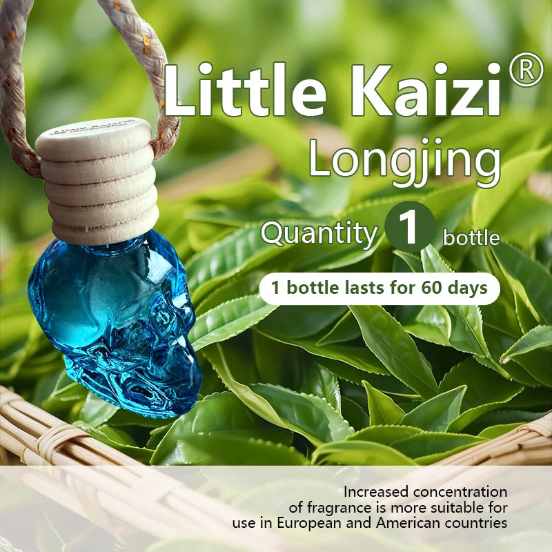 Little Kaizi Longjing skull-shaped air freshener bottle with a cork, surrounded by fresh green leaves.