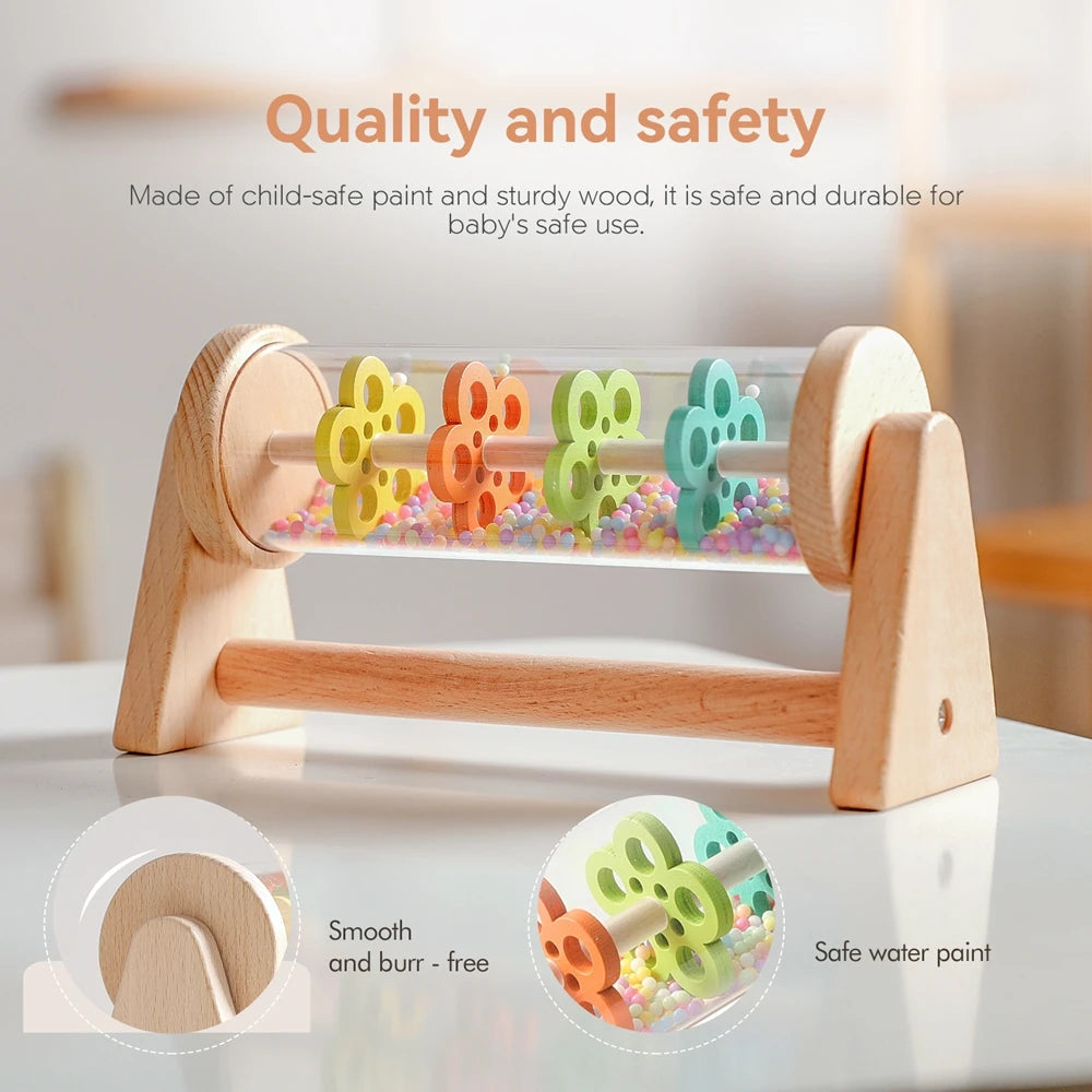 A wooden rainmaker musical toy featuring colorful, safe water paint and sturdy wood for baby's use.