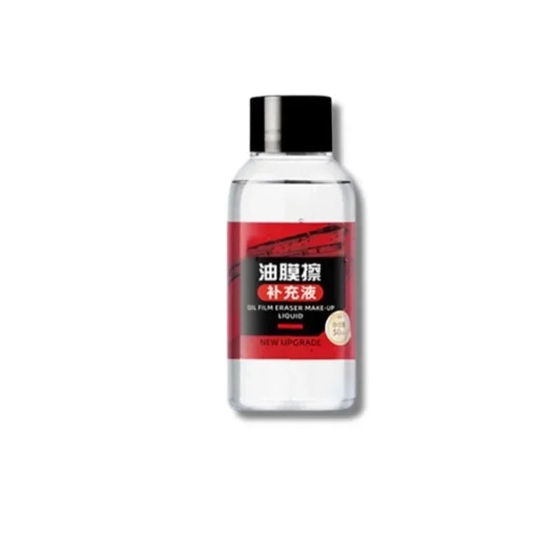 A clear bottle of oil film eraser liquid with a red label and black cap.