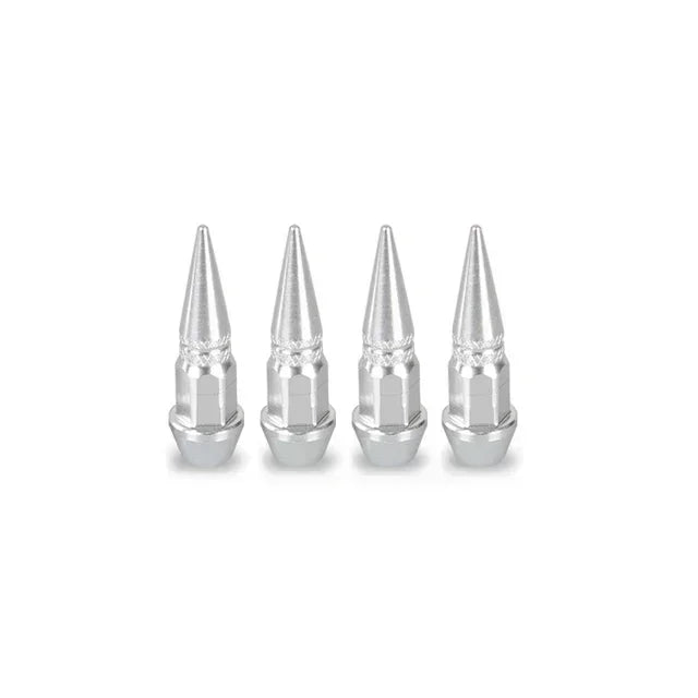 A set of four silver aluminum tire valve stem caps.