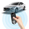 A hand holds a universal car key cover over a Mazda vehicle, demonstrating its use for unlocking.