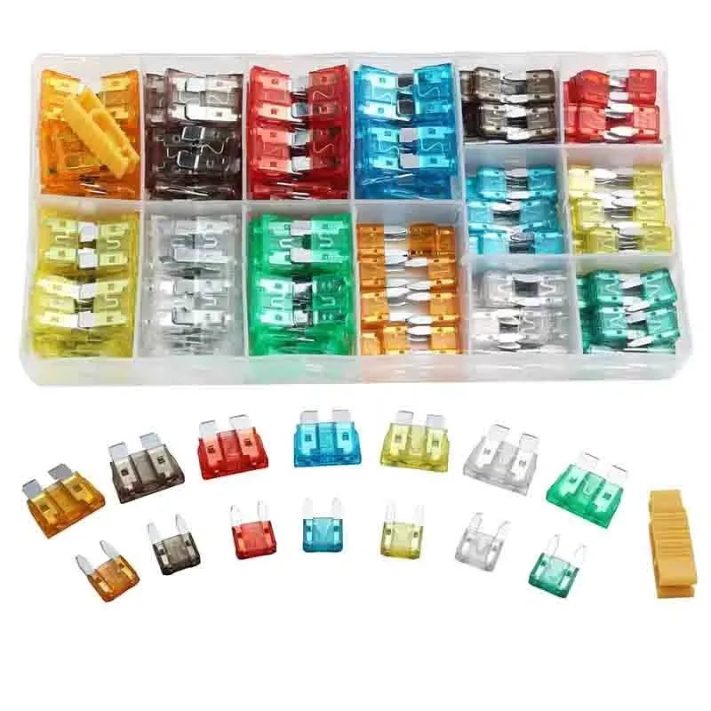 A plastic storage tray filled with various colored automotive blade fuses for vehicles.