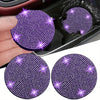 Two purple imitation diamond car cup coasters are shown, one being held by a hand.