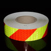 Roll of high-visibility fluorescent reflective safety tape with a yellow-green color and red stripes.