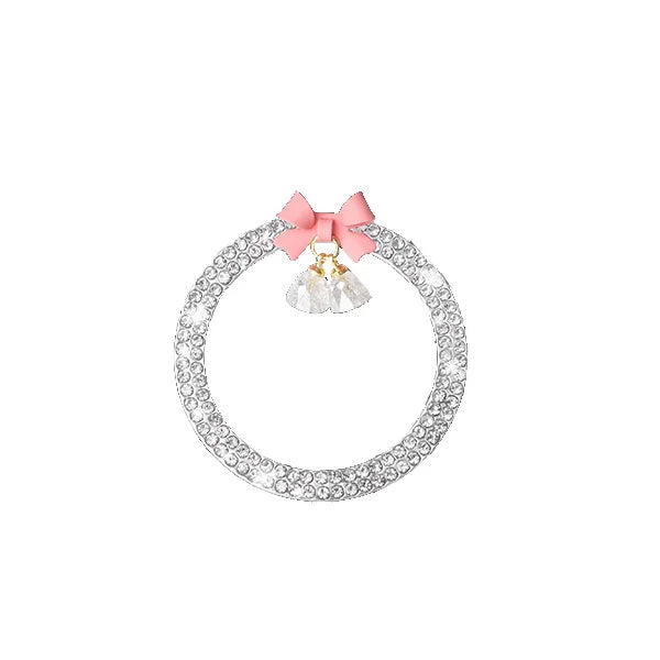 A decorative rhinestone bow bell trim for a car start switch button.
