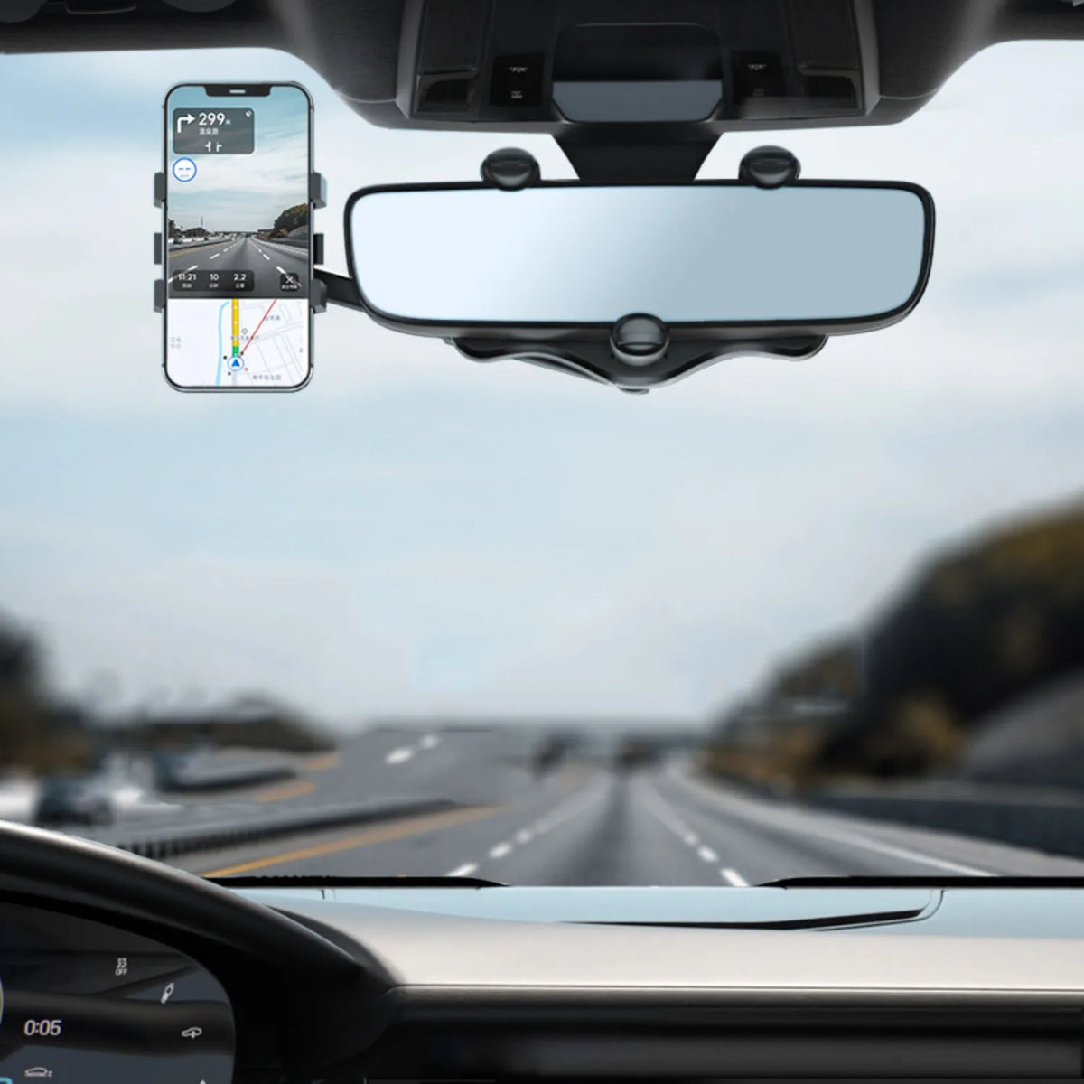 A rearview mirror shows a smartphone mounted on a car windshield, displaying navigation and driving information.