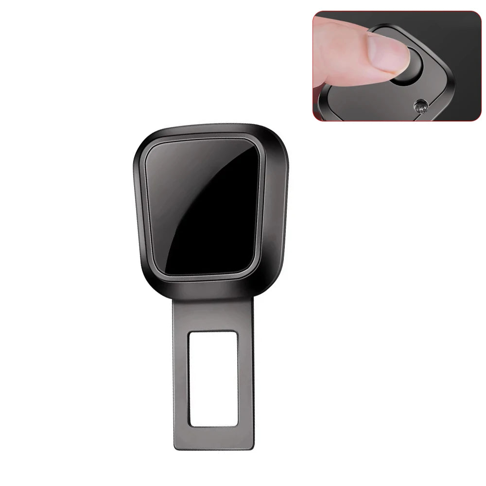 A close-up view of a black car seat belt extender with a quick-release buckle and a rectangular plastic frame.