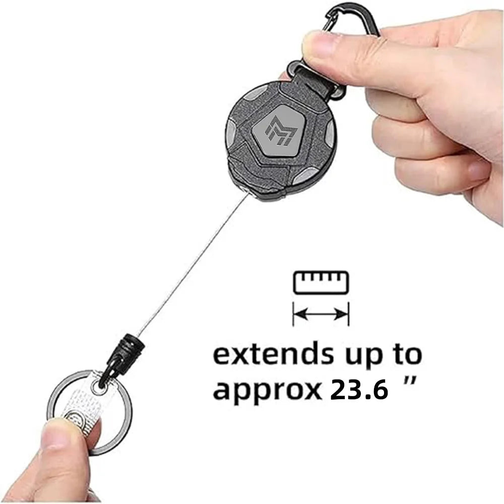 A hand holds a heavy-duty retractable keychain badge holder with a carabiner, showing its extension capability.