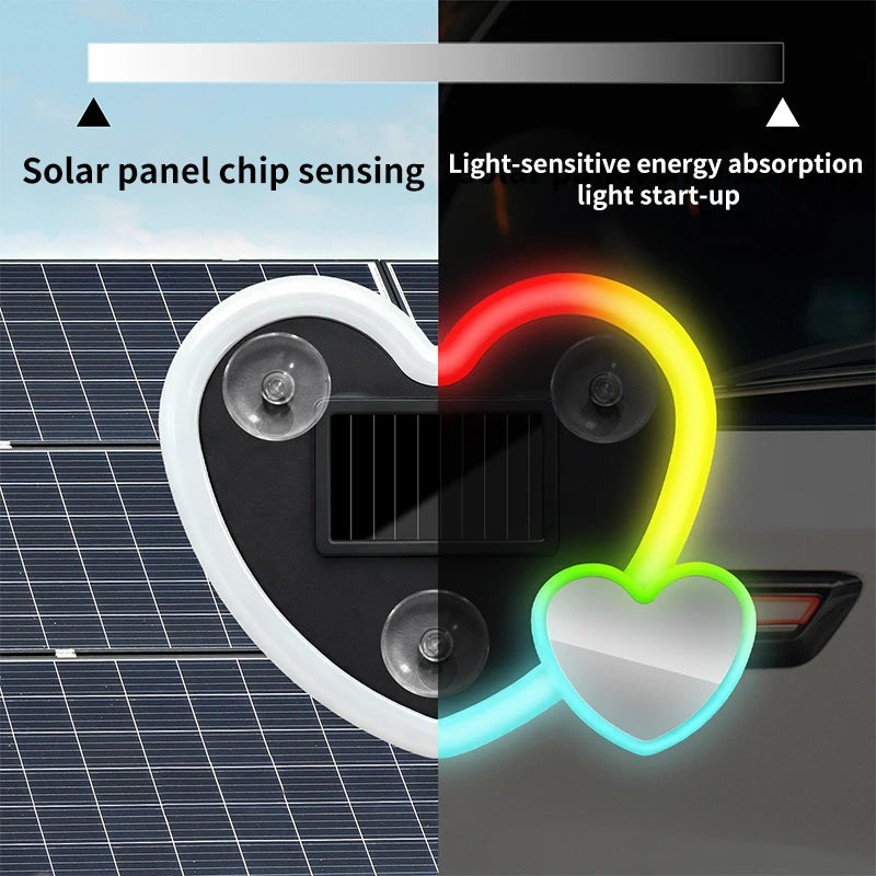 A heart-shaped solar lamp with a solar panel and light-sensitive energy absorption features glowing colors.