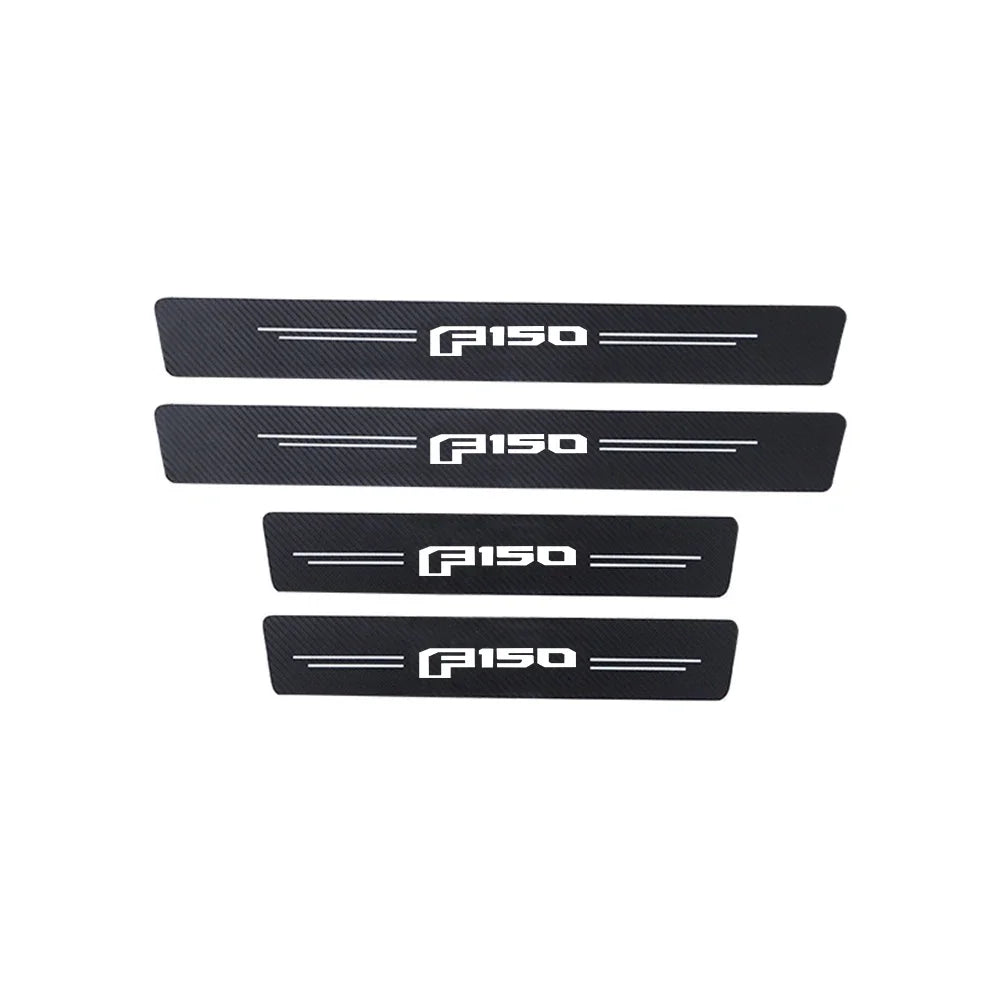 Three black door sill protectors for a Ford F-150 truck.