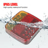 A red magnetic wireless LED tail light housing is shown being splashed by water, demonstrating its IP65 waterproof function.