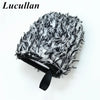 A black and white faux fur detailing wash mitt with a black grip band.