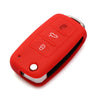 A red silicone car key cover with multiple buttons and a silver key inside.