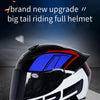 A black and white racing-style motorcycle helmet with blue accents is shown against a dark background.