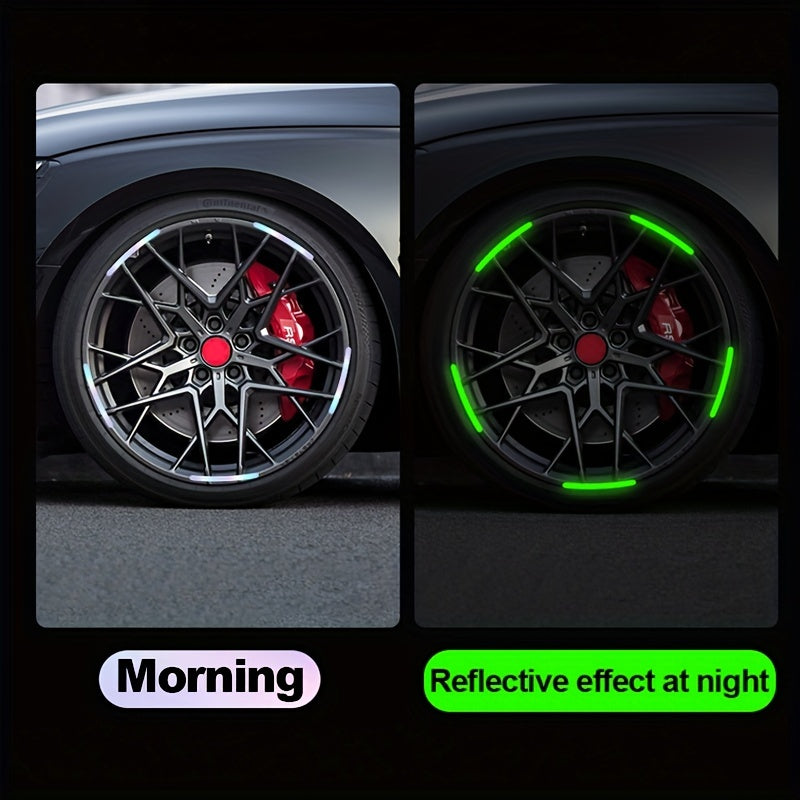 Close-up of a black car wheel with red brake calipers and green reflective decals on the spokes.