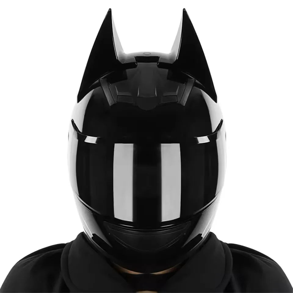 Black full face motorcycle helmet with prominent horns