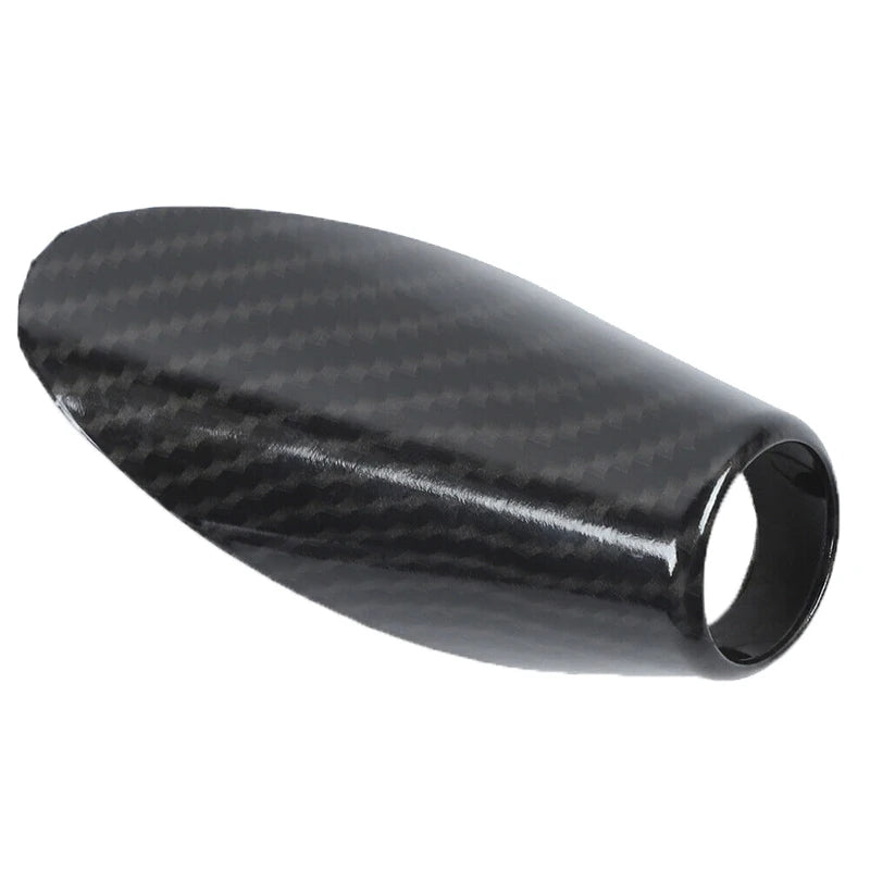 Black carbon fiber look antenna base trim for a Dodge RAM vehicle.