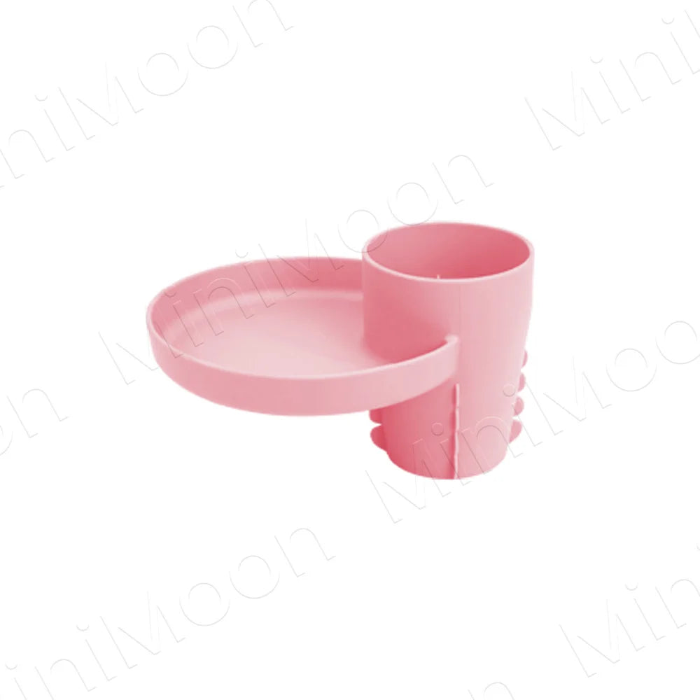 A pink 3-in-1 expandable travel tray designed for car seats and strollers.