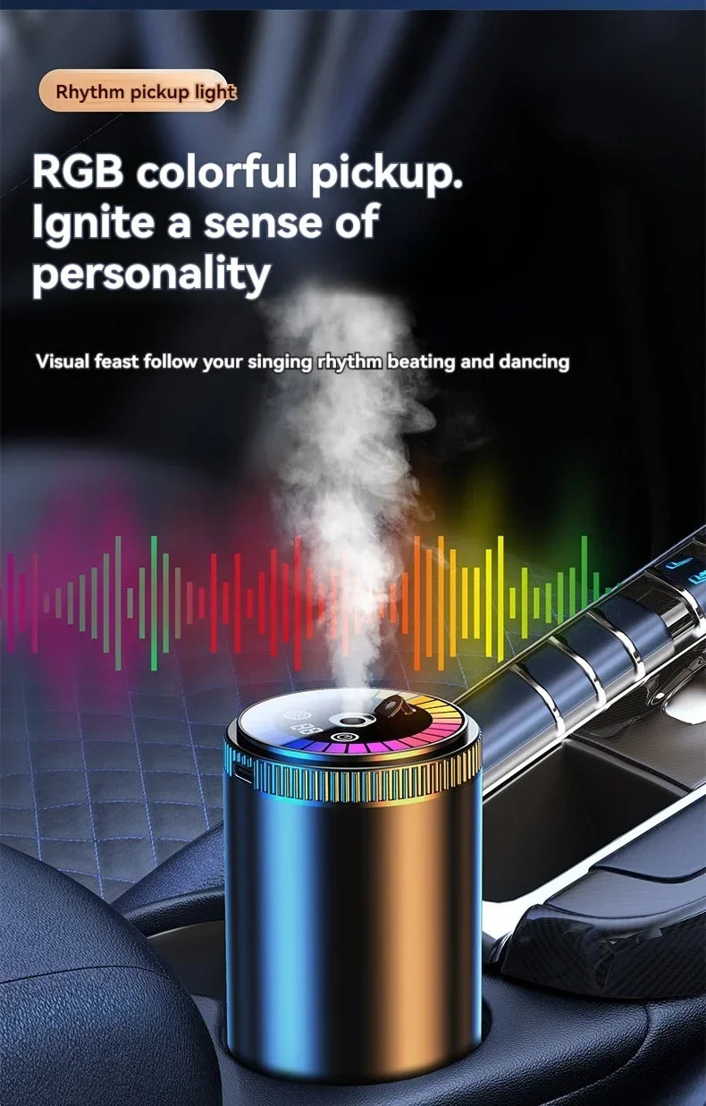 A close-up of an RGB colorful pickup light air freshener device resting on a car interior surface.