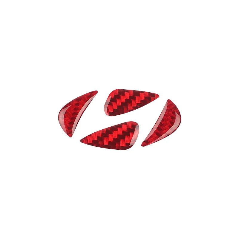 Three red carbon fiber steering wheel trim decals arranged in a cluster.