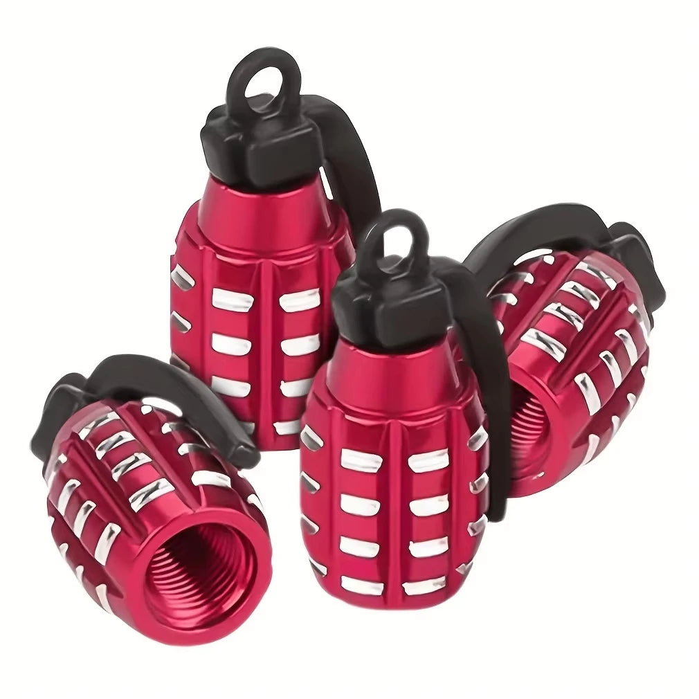 A set of four red and black aluminum tire valve caps with a textured finish.