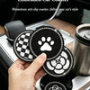 A hand holds a set of light luxury diamond-embedded car coasters in a cup holder.
