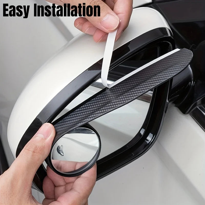 Hands installing dual car blind spot mirrors with rain shields onto a vehicle's exterior.