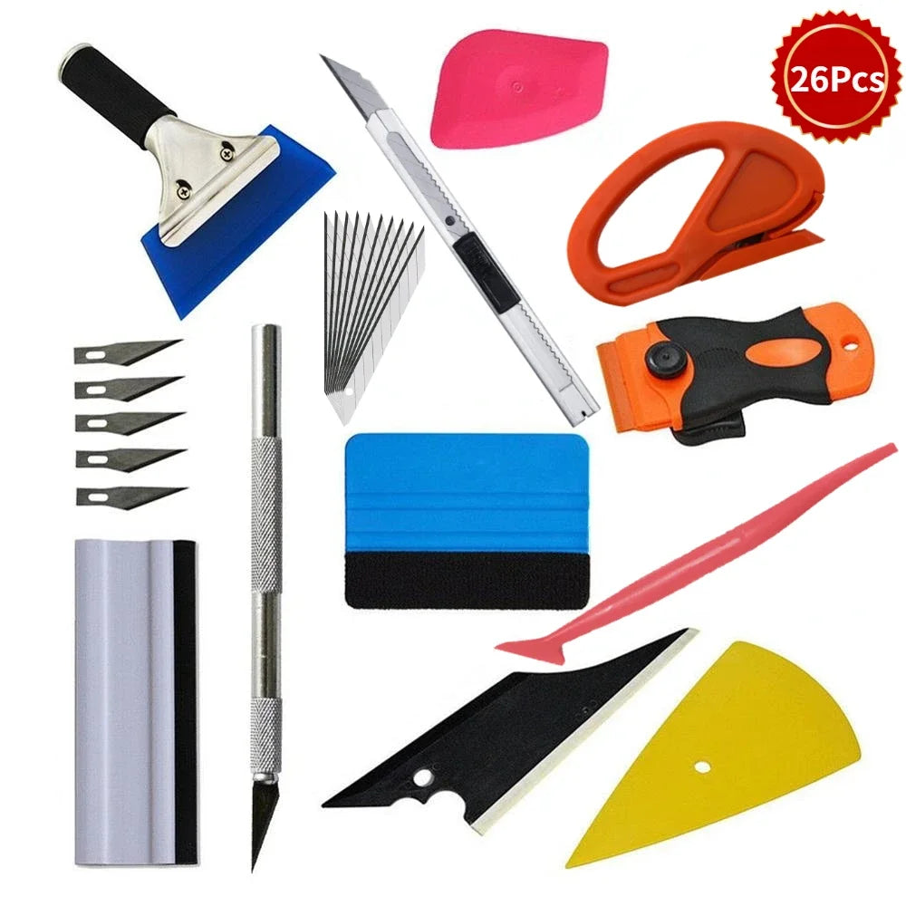 A set of professional car vinyl wrap tools including a blade, scraper, and various cutting implements.