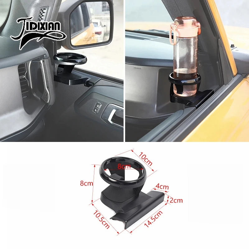 A black cup holder accessory designed for a Ford Bronco, featuring an adjustable mount and a clear glass cup.