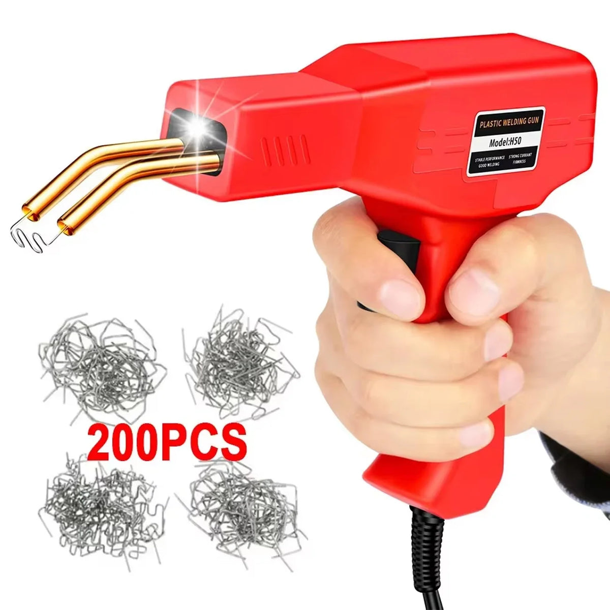 A hand holds a red plastic welding gun with a gold tip, next to several packs of wire for DIY repairs.
