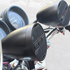 Close-up view of a black motorcycle Bluetooth speaker system with FM radio and USB features.