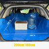 Blue waterproof car trunk liner mat showing a storage box and a bottle inside the interior
