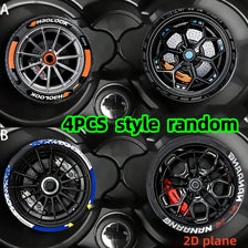 Four pieces of 2D plane car-shaped silicone coasters with racing wheel hub designs in various styles
