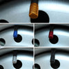 A set of aluminum tire valve caps in various colors including gold, blue, red, and silver.
