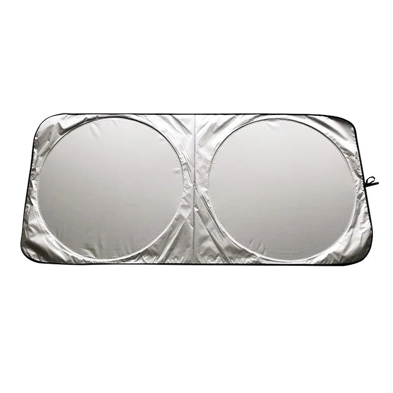 Folding car sunshade for windshield UV protection, silver-colored, shown flat.