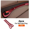 Two red car seat gap plugs used to fill the space between car seats.
