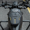 A black motorcycle accessory featuring a fanny pack designed to be adsorbed onto the fuel tank.