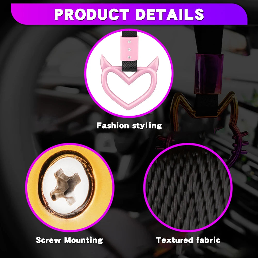Close-up of a pink heart-shaped JDM racing handle accessory showing fashion styling, screw mounting, and textured fabric deta