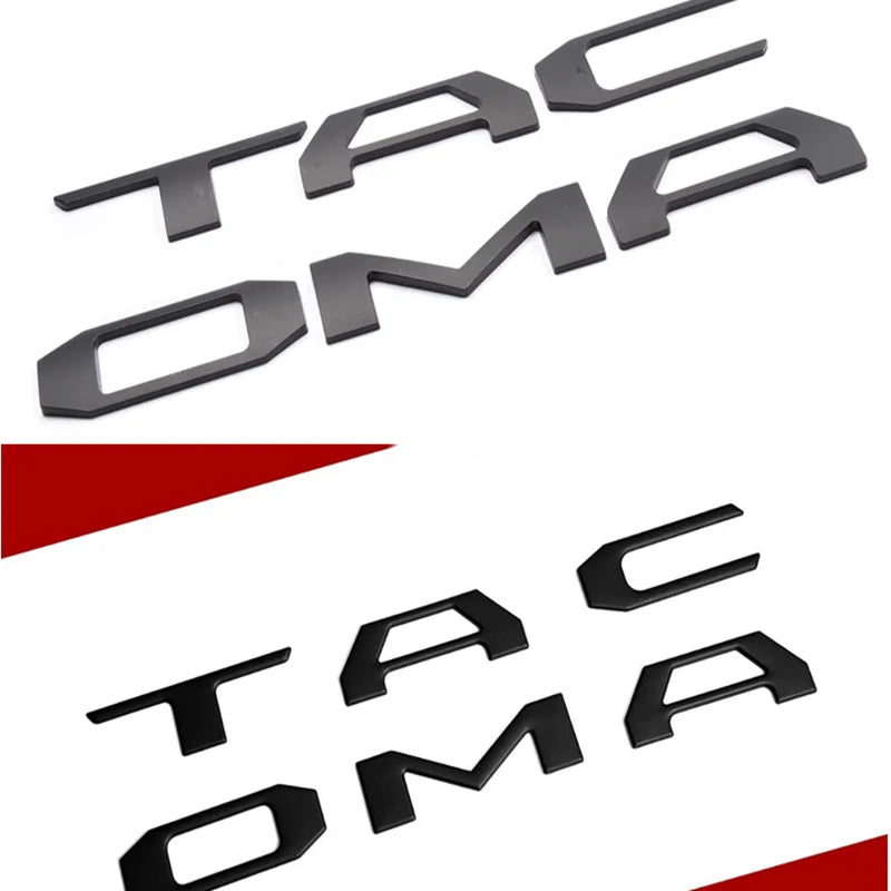 Black 3D letter cover emblem for Toyota Tacoma tailgate featuring the letters TAC OMA.