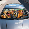 A dog-themed car windshield sunshade featuring several happy dogs looking out from the interior.