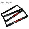 A pair of black JDM racing style license plate frames for decoration.