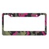 A license plate cover featuring a camouflage pattern of green, black, and magenta colors.