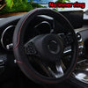 Black steering wheel with red stitching and a circular emblem, showing no inner ring.