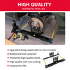 A black automotive wheel alignment tool kit is shown mounted on a car's suspension component.